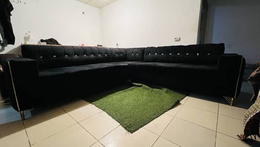 L shape good condition 7 to 8 seater sofa black color for sale