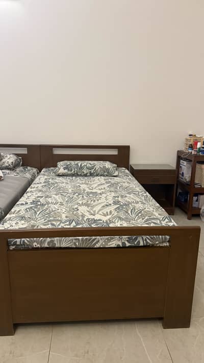 Two Wooden Single beds with mattress and side tables