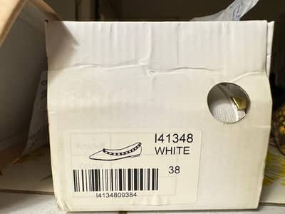 Brand new white pumps