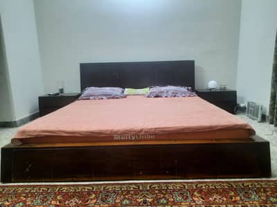 bed with side tables and spring mattress for sale