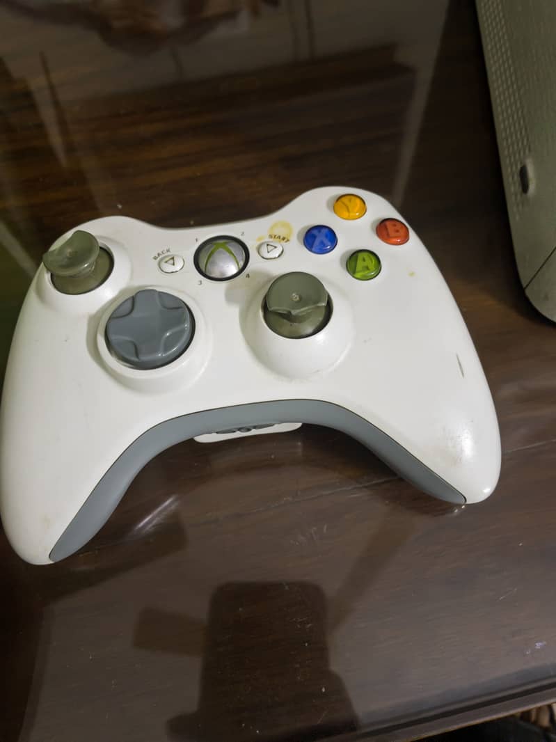 Xbox 360 with two controllers 3