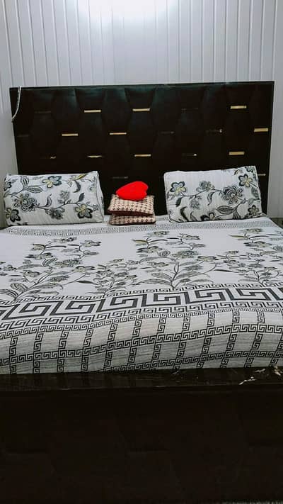King size bed with side table