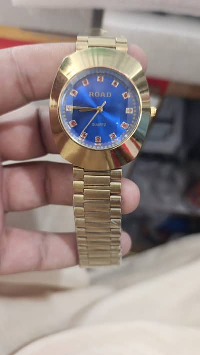 ROAD Gold Quartz Watch – Blue Shield & Red Facet Variants | Swiss-Grad
