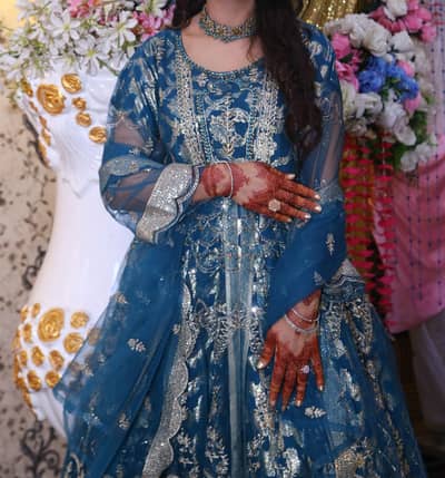 Elegant Heavy Embroidered Maxi with Net Dupatta and trouser wear once.