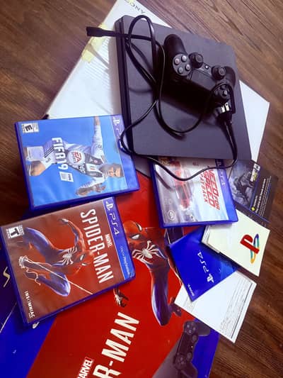 Sony PlayStation 4 Slim (PS4 Slim) with accessories and box
