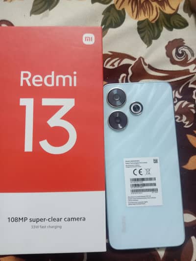 redmi 13 phone with  new charger  and mobile ka box bhi hai