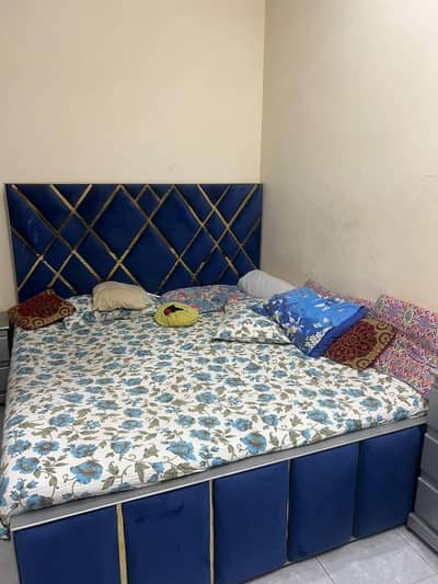 bed with matress side tables and dressing