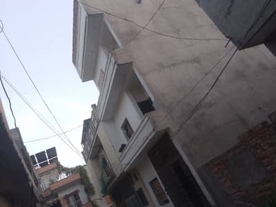 5 Marla triple story building /house/flats on rent for family and boys green cape opposite gajjumate metro station Lahore