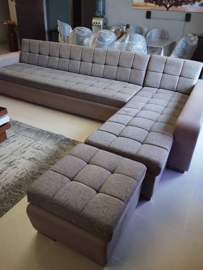 L shaped 8 seater with a puffy