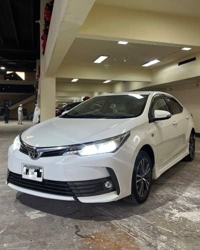 Toyota Corolla Altis  Model 2021 manufacturing 2020 super white  orig
