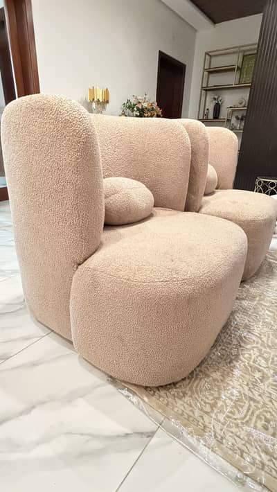Slightly used sofa chairs with boucle fabric coloyr is beige