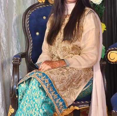 eligent golden tila work kurti with turquiose jamawar trouser