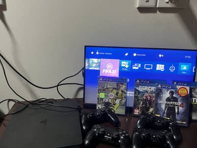 Ps4 slim 500gb with four controllers and monitor with original ps4 box