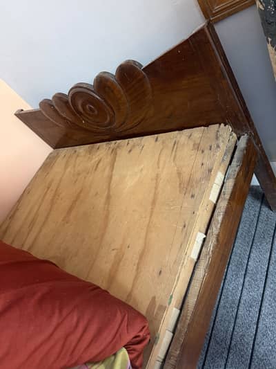 2 identical wooden single beds