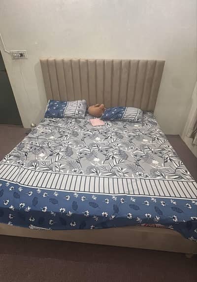 Wooden bed for sale.