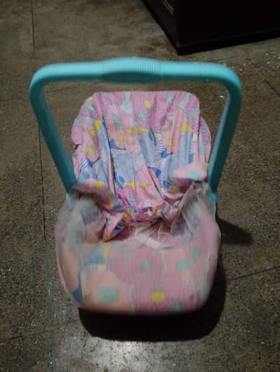baby walker and carrycot