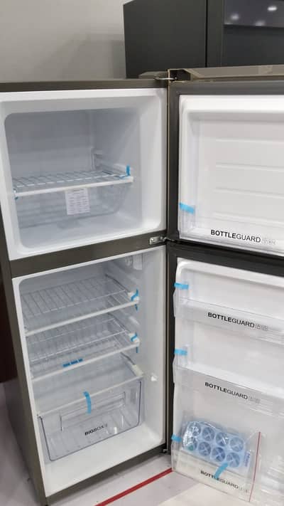Small size un used brand new fridge in light golden color