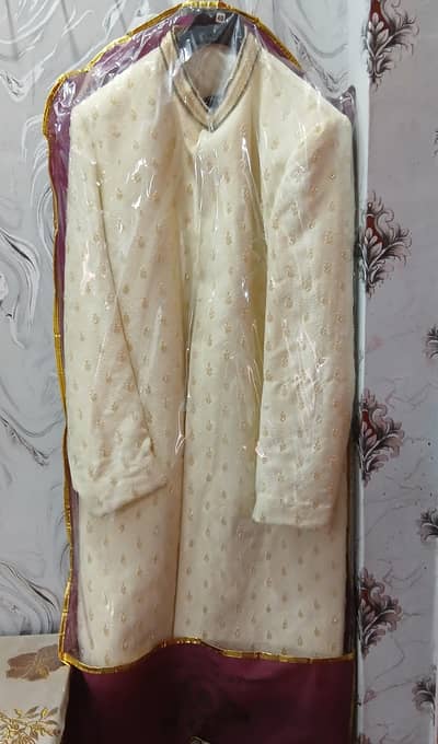 Sherwani with bracelet and cap