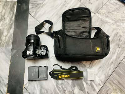 Nikon d3500 body with 50mm F1.8N yongnuo prime lens and accessories.