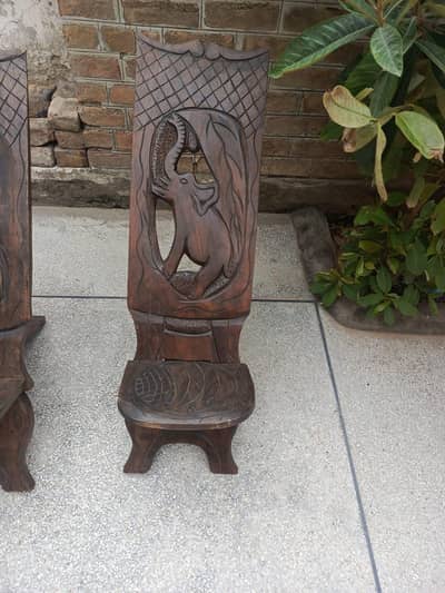 2 African black wood chairs