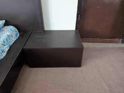Double bed with dressing side table and wall lamps