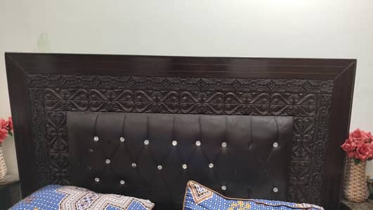 King size bed with side tables and dressing table.