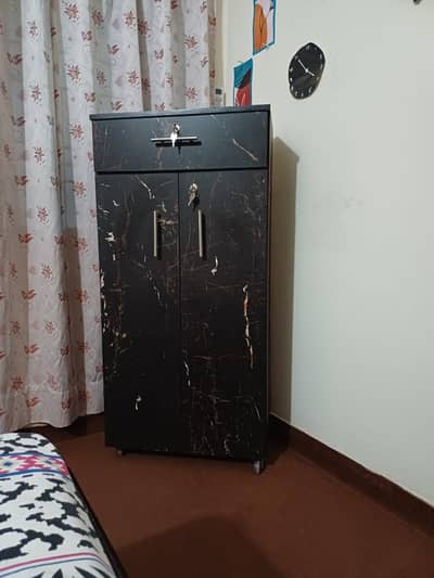 black storage cupboard