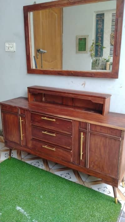 Wood table and wall mounted almaari