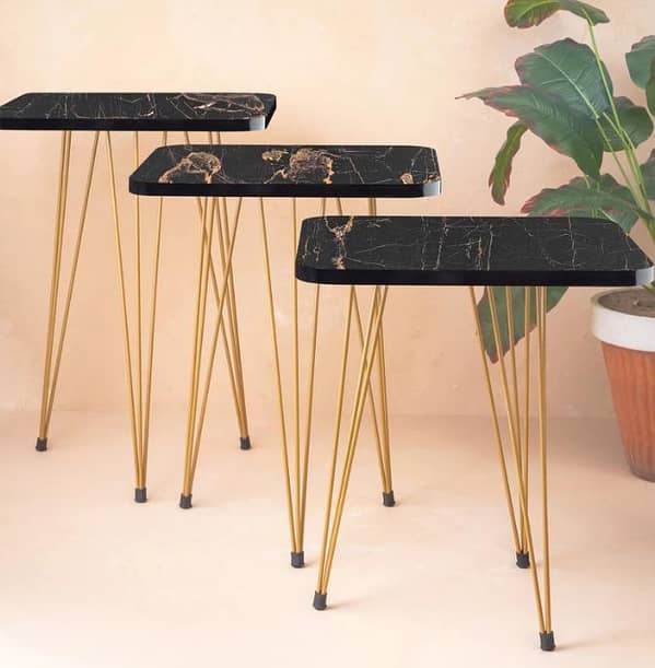 Square Nesting Table Compact and stylish multi-use tables designed for easy storage, decorative displays,