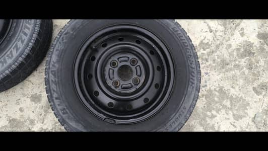 Bridgestone tyres with Rims and wheel Covers