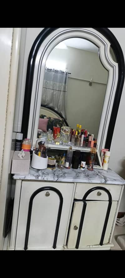 Dressing table with seat inside