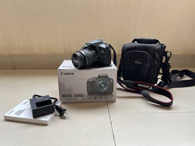 Canon EOS 2000D with 18-55mm lens and full kit