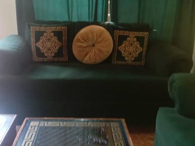 7 seater sofa 4 cotton 2 green 2 skin  and 3 tables