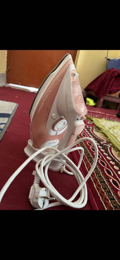 Steam iron pink colour