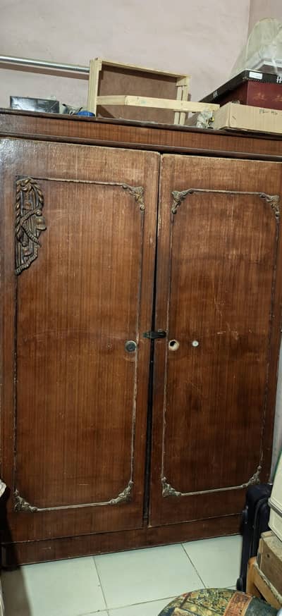 3 doors cupboard, wooden divider and wrought iron bed