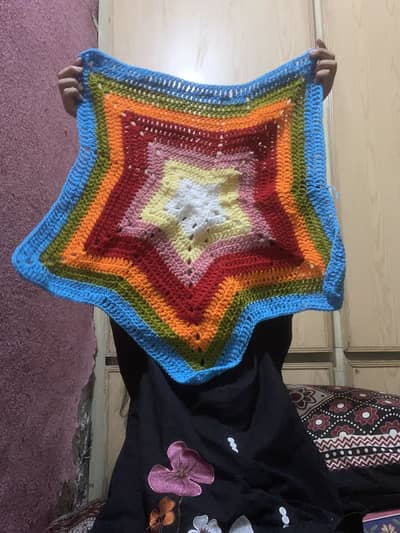Rainbow crocheted star mat