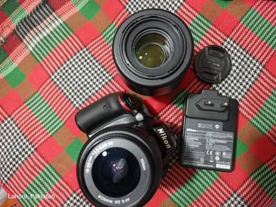 Nikon D5100 with two lenses 18-55 and 55-200