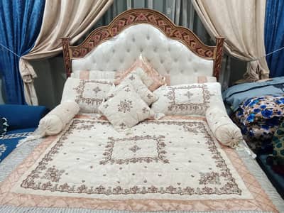 king size bed without mattress and fancy bedsheet