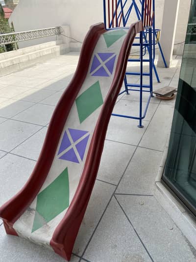 Finer glass slide and metal stairs and metal swing