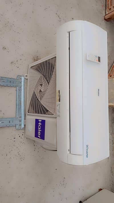 Haier DC inverter. 1tan. . bilkul okay hai indoor outdoor remote plate