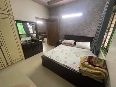 Bed, dressing mirror, and 2 side tables