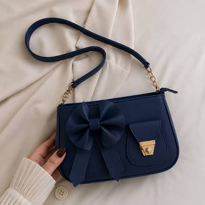 Bella bow shoulder bag available in different colours