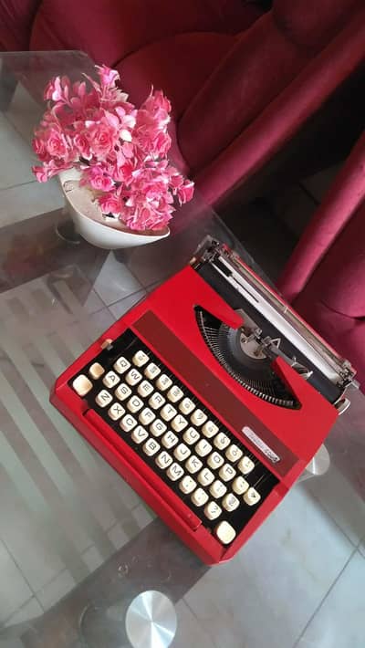 old antique Seville model 3000 typewriter red color