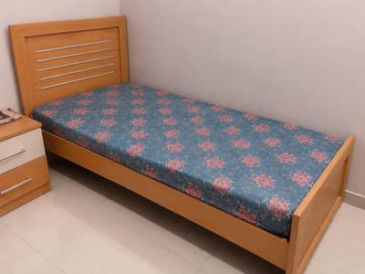 Single bedin used  (wooden made)