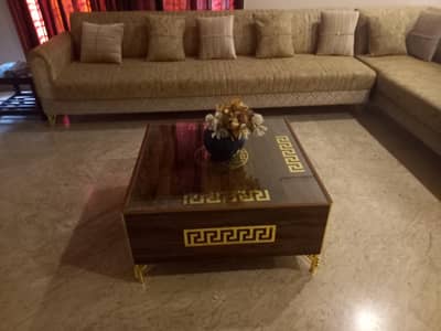 wooden center table with glass top and gold detailing excellent c