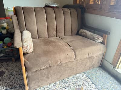 Brown tufted sofa