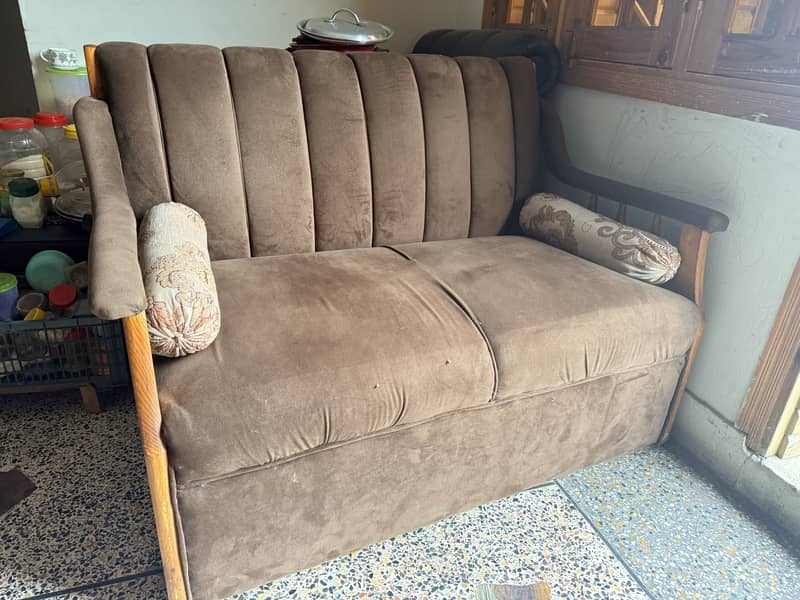 Brown tufted sofa 0