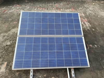 Two solar plates 12 watt one new battery in warranty and 12 watt fan