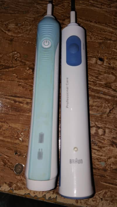braun oral b electric toothbrush machine with 2new  brushes and box