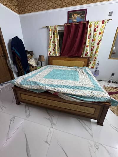 used wooden bed available for sale